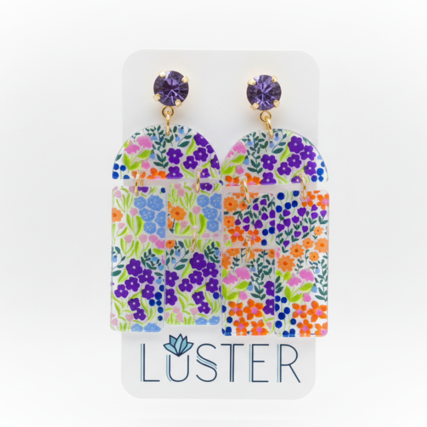 Floral patterned earrings on a Luster branded card
