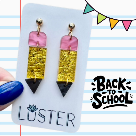 Colorful pencil earrings on a Luster branded card with 'Back to School' text.