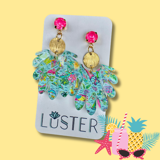 Colorful floral beach earrings on a Luster branded card with a yellow background