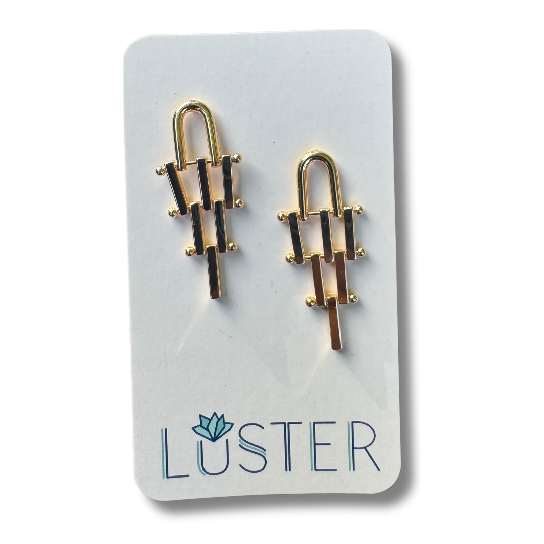Gold brass earrings on a Luster branded card