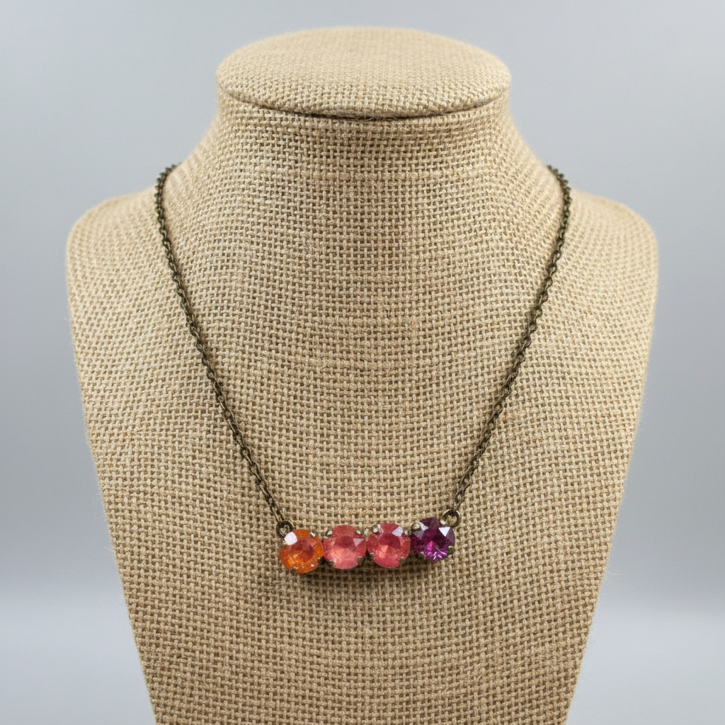 Necklace with colorful beads on a Luster branded card
