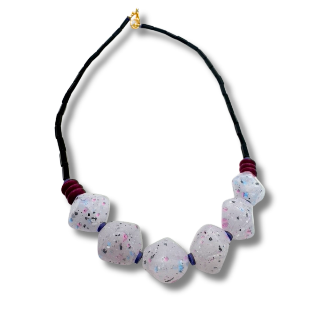 Necklace with speckled beads on a white background