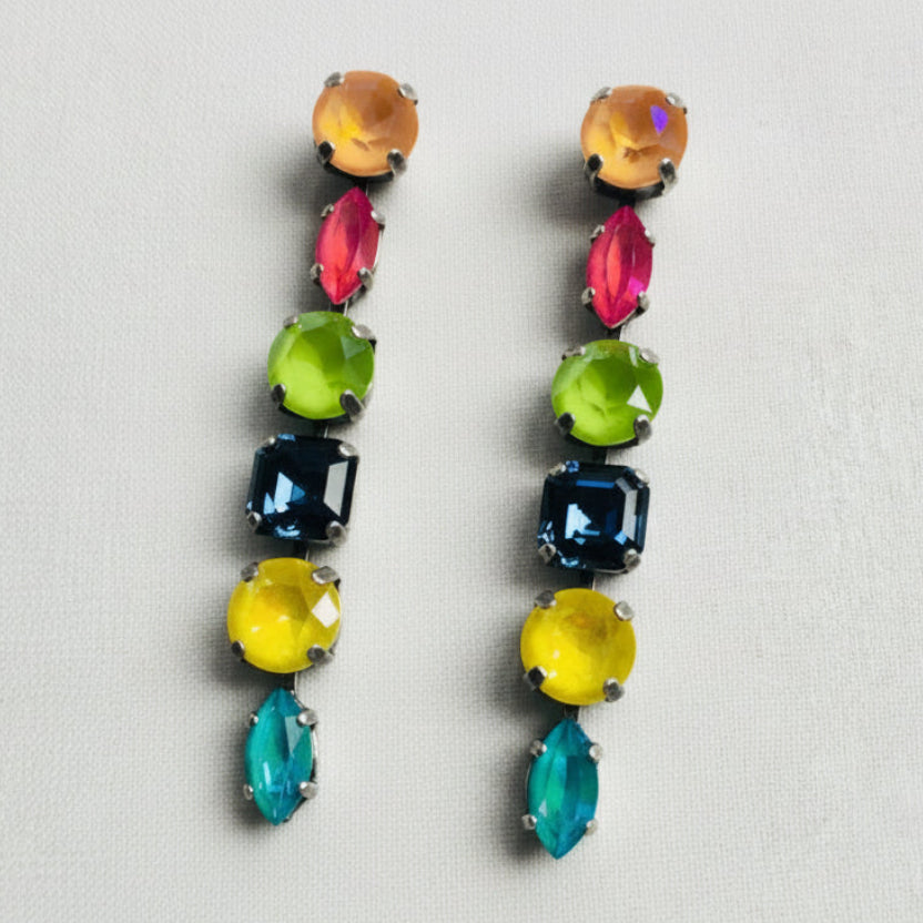 Multicolored gemstone earrings on a white background