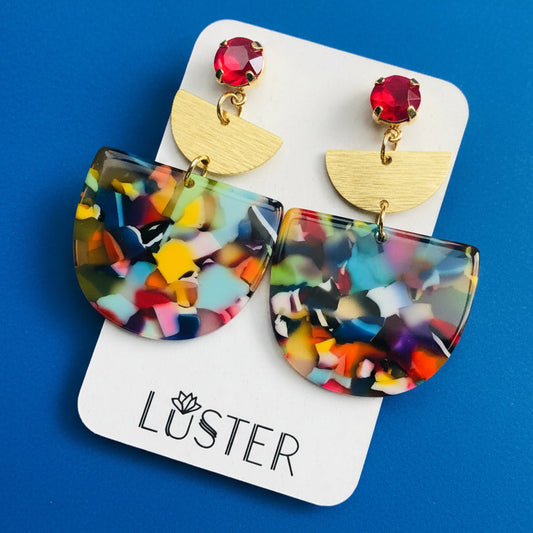 Colorful mosaic earrings with gold accents on a Luster branded card.