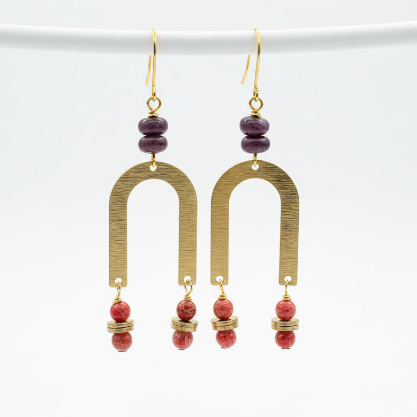 Brass horseshoes with purple and orange stones
