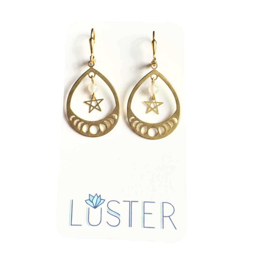 Gold teardrop earrings with star design on a white background, featuring the 'Luster' brand.