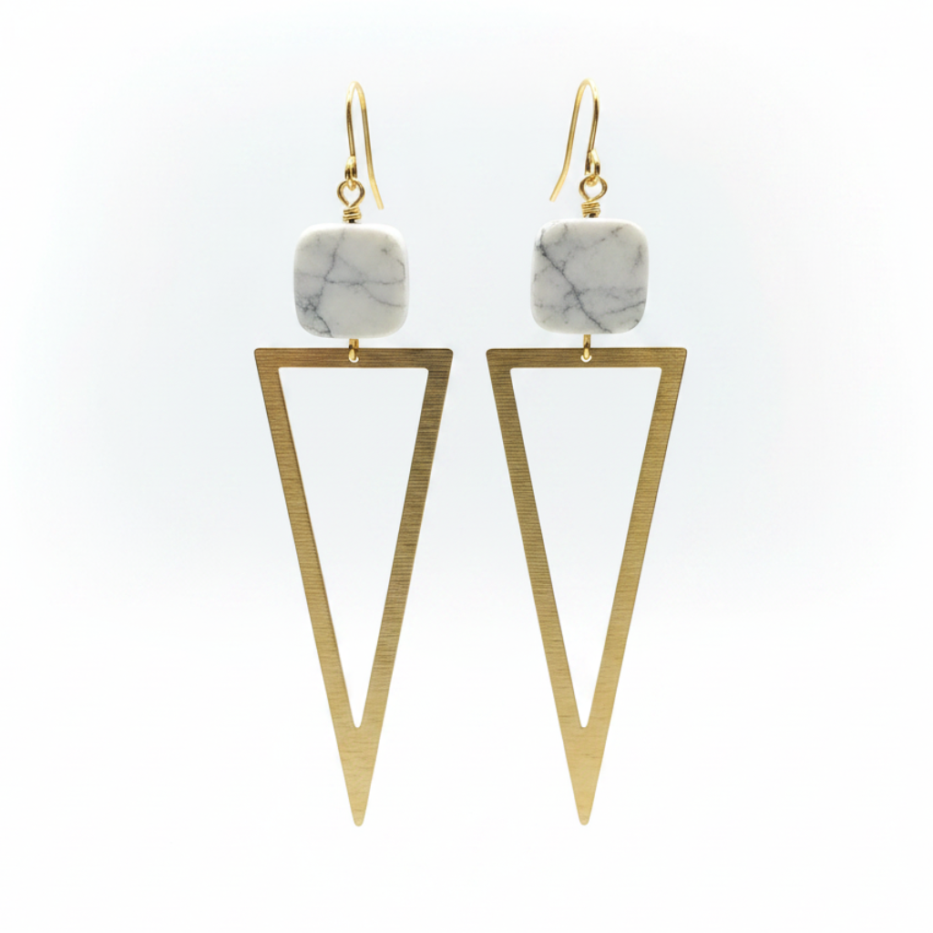 A pair of geometric drop earrings featuring square white and gray marble beads at the top and open triangular gold-tone metal drops below, shown against a plain white background.
