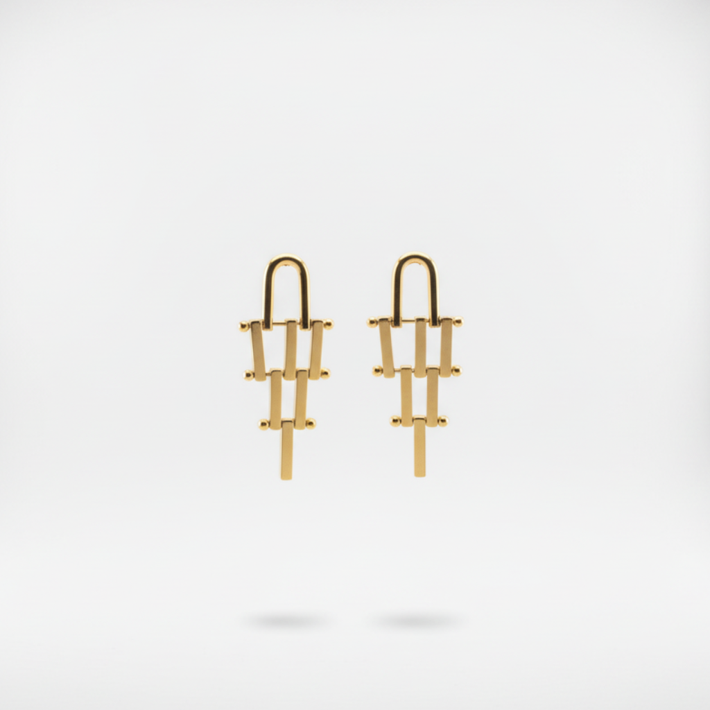 Gold earrings on a white background
