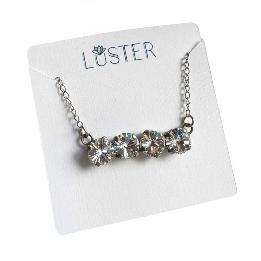 Necklace with clear crystals on a Luster branded card