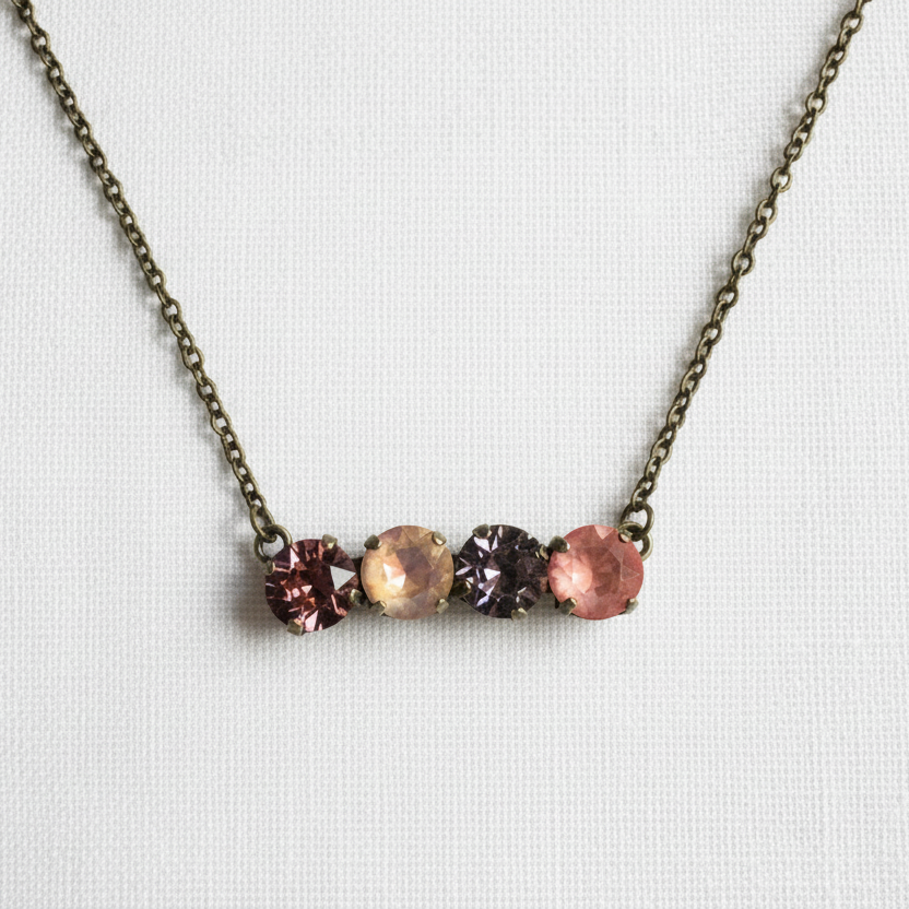 Necklace with four crystals on antique brass chain